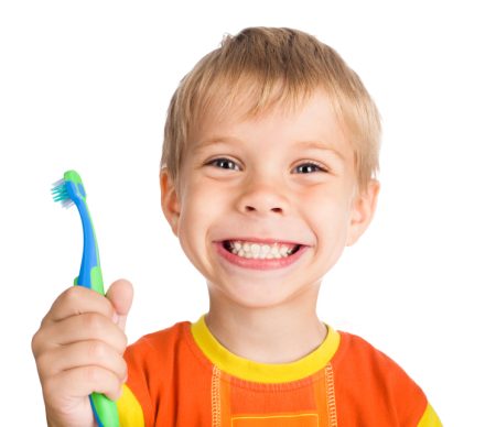 Smiling boy with toothbrush